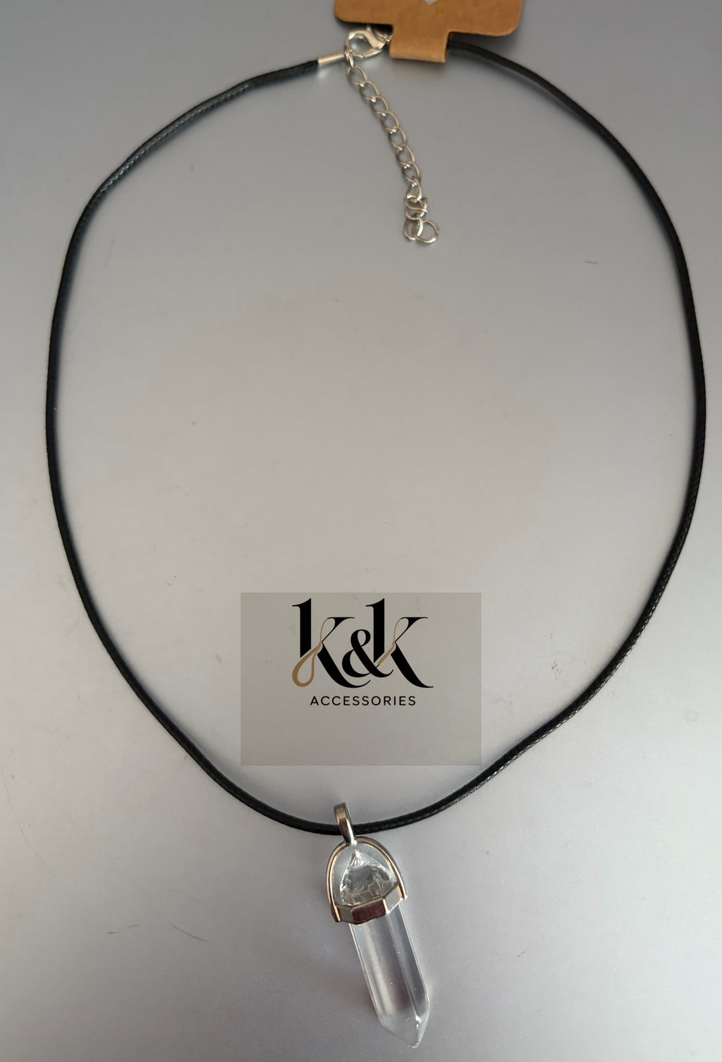 Clear quartz crystal point pendant necklace on black cord
